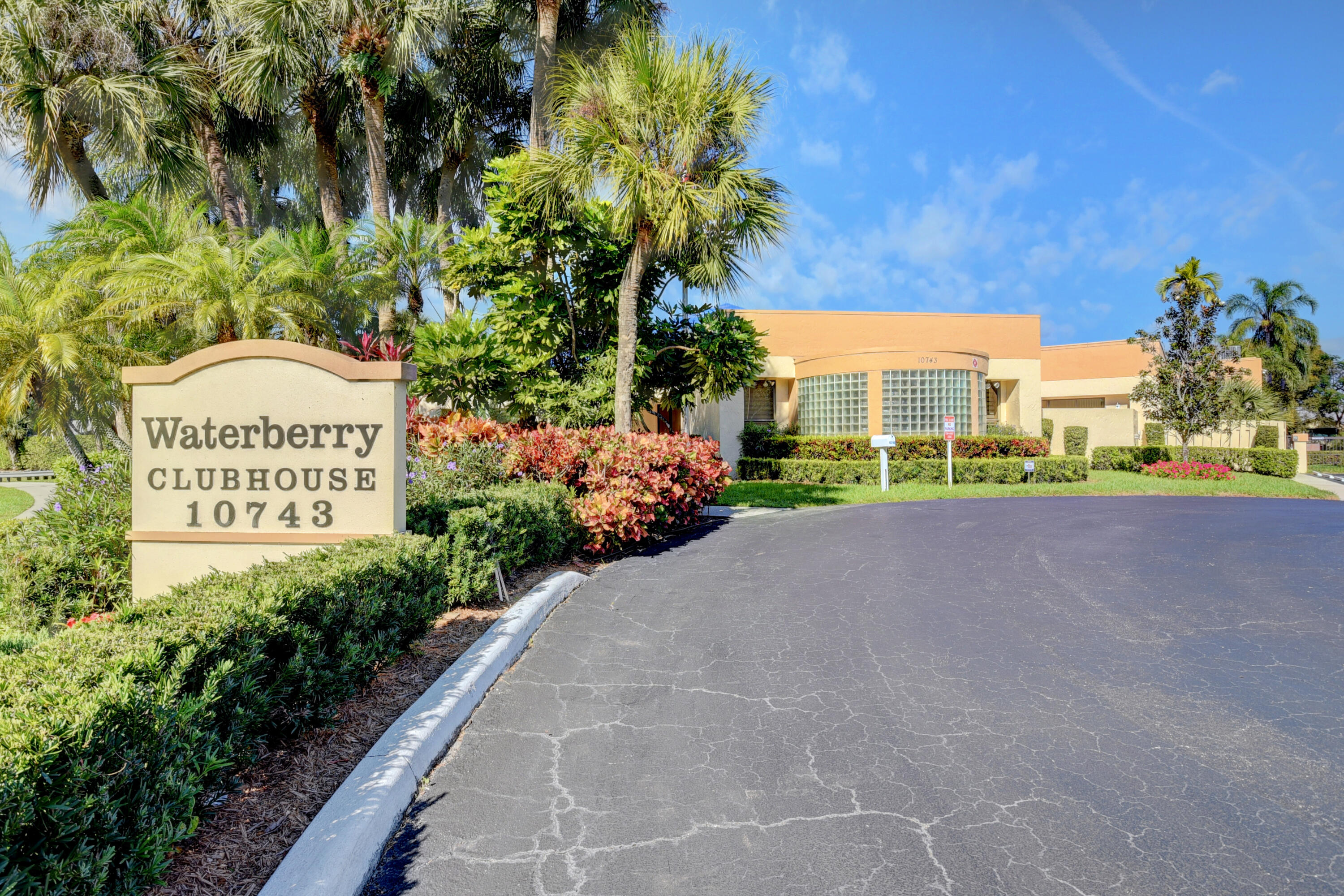 10980 Hidden Lake Place Boca Raton, FL 33498 - Photo 30 of 47 a view of a street with a building in the background