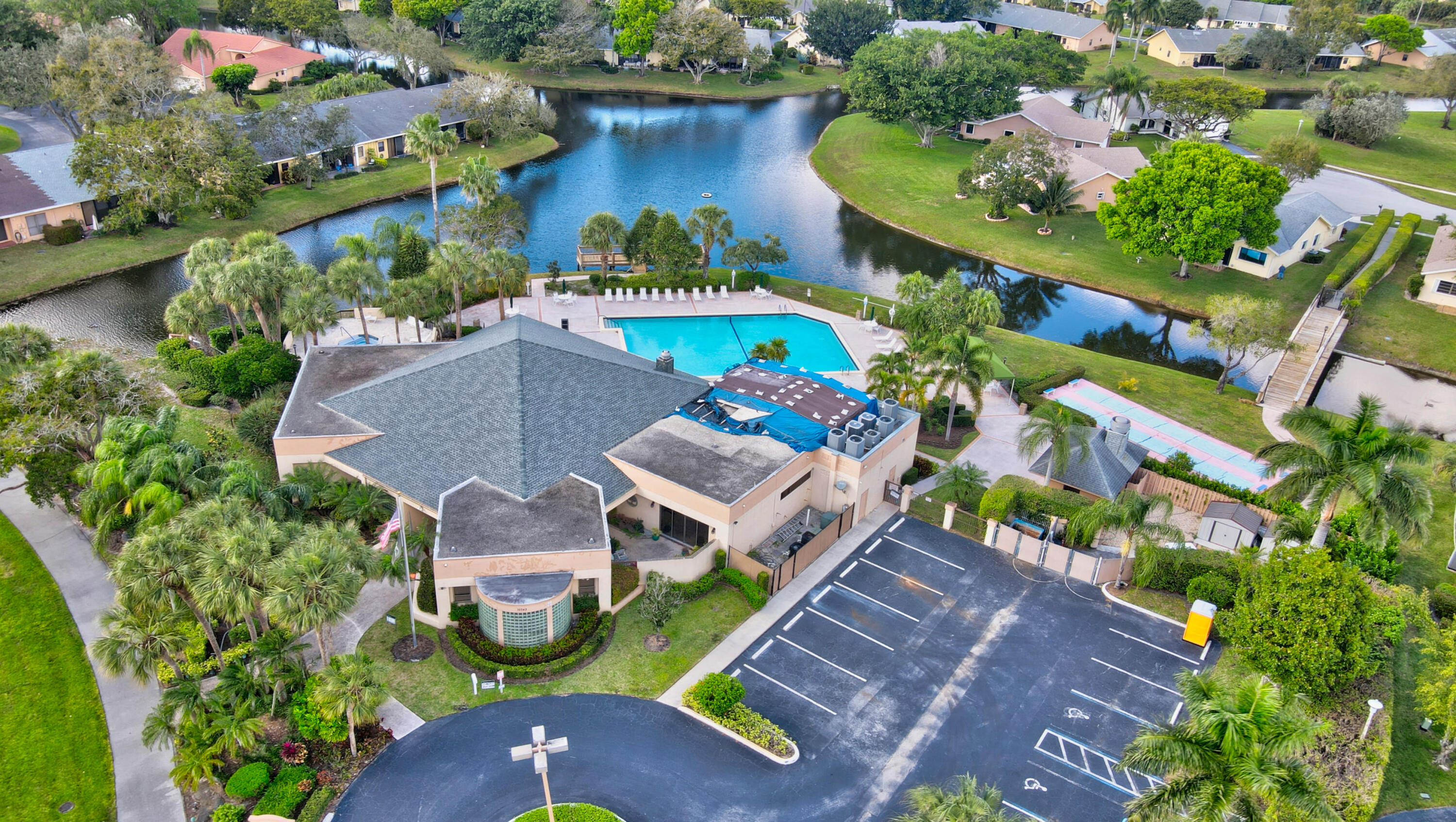 10980 Hidden Lake Place Boca Raton, FL 33498 - Photo 33 of 47 an aerial view of a house with a garden and swimming pool