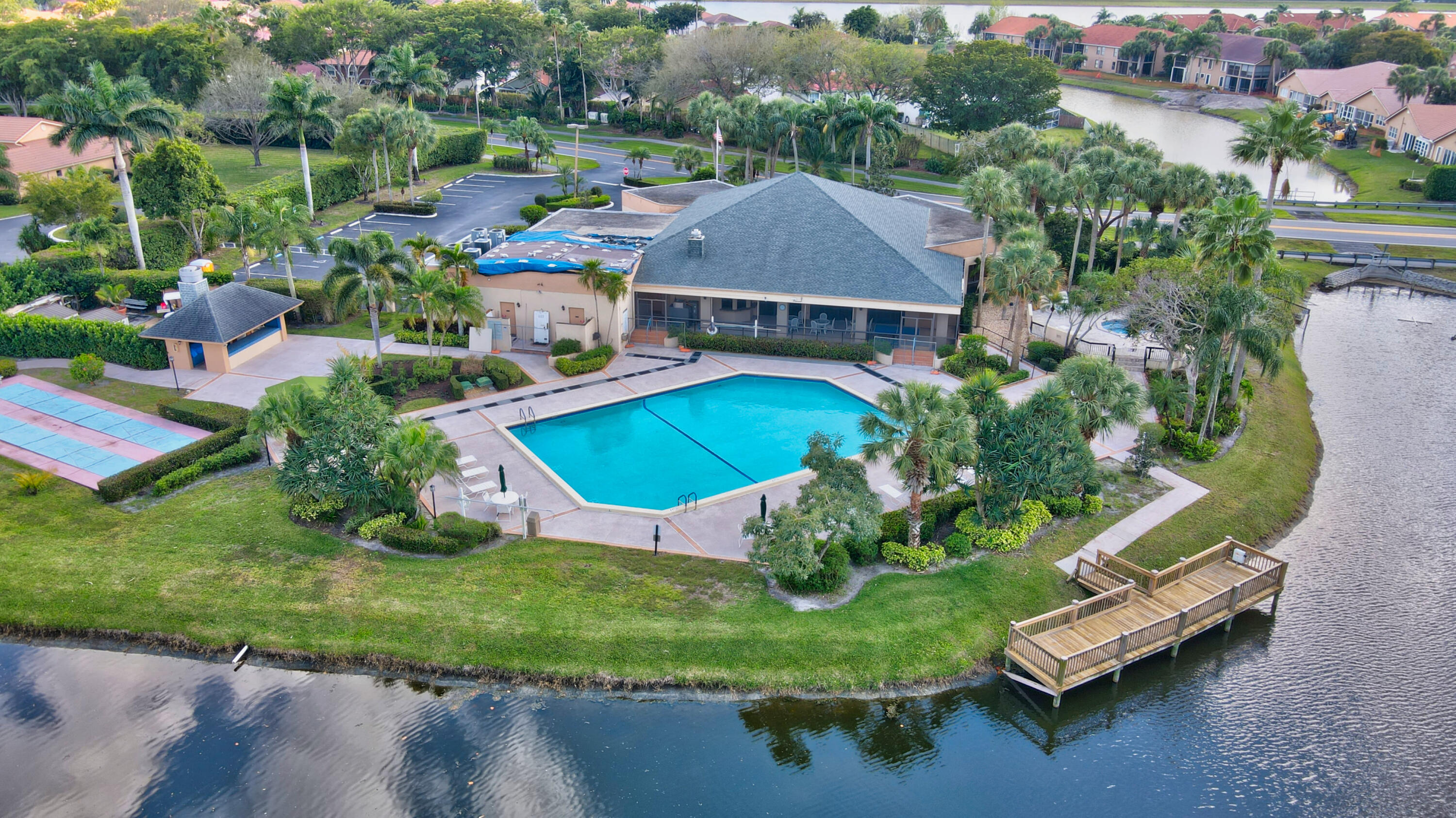 10980 Hidden Lake Place Boca Raton, FL 33498 - Photo 34 of 47 an aerial view of a house with a garden and lake view