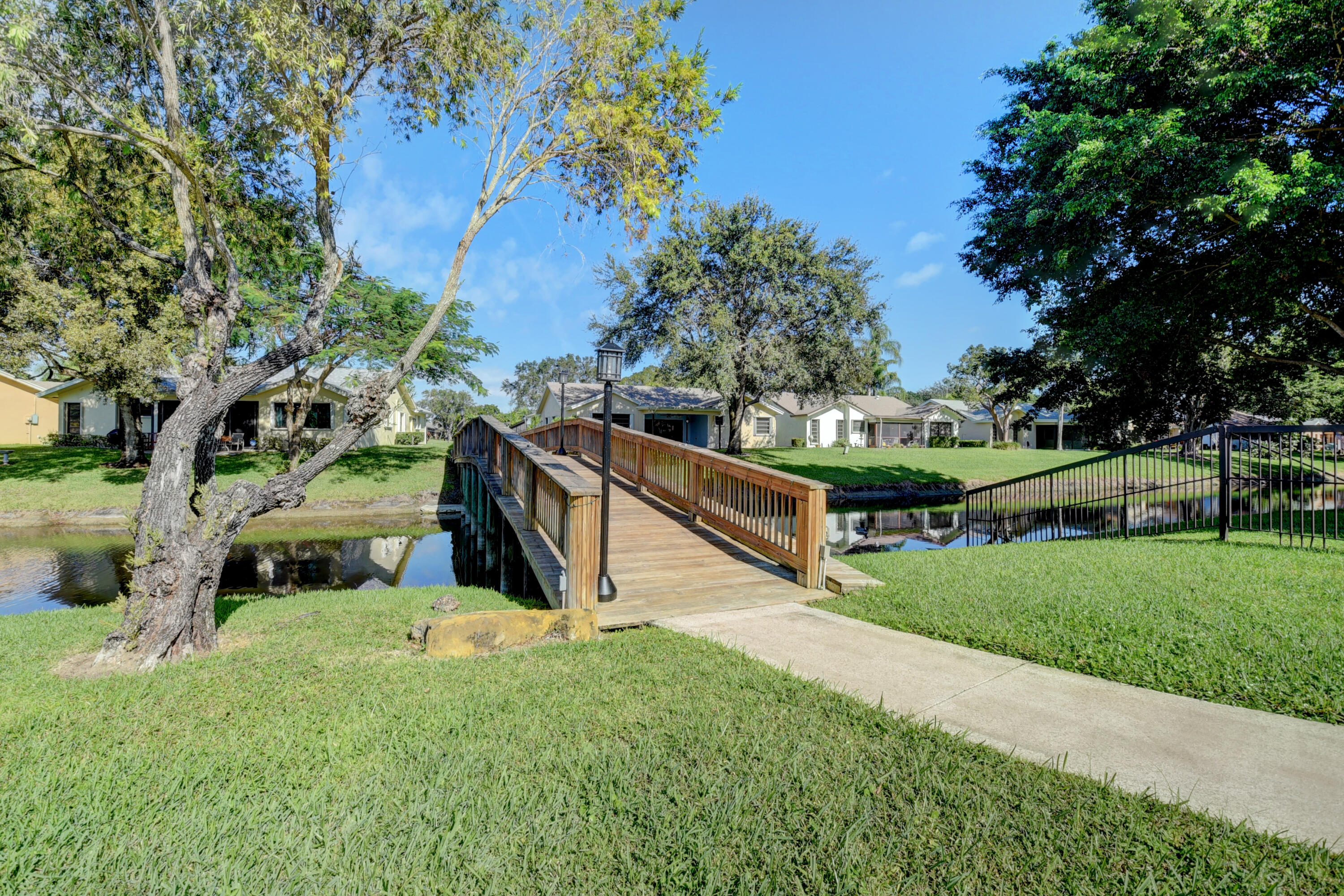 10980 Hidden Lake Place Boca Raton, FL 33498 - Photo 46 of 47 a view of an outdoor space and yard