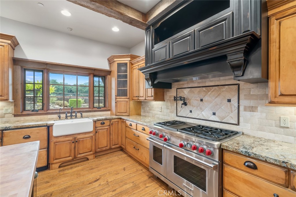 10330 Huasna Road Arroyo Grande, CA 93420 - Photo 12 of 74 a kitchen with a stove and a sink