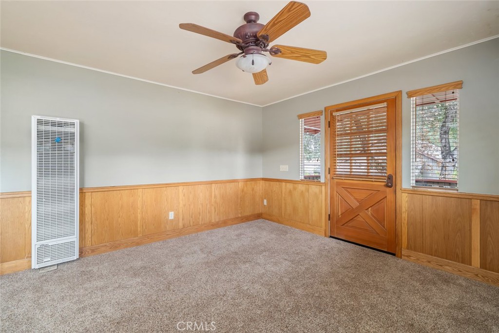 10330 Huasna Road Arroyo Grande, CA 93420 - Photo 45 of 74 an empty room with chandelier fan and windows
