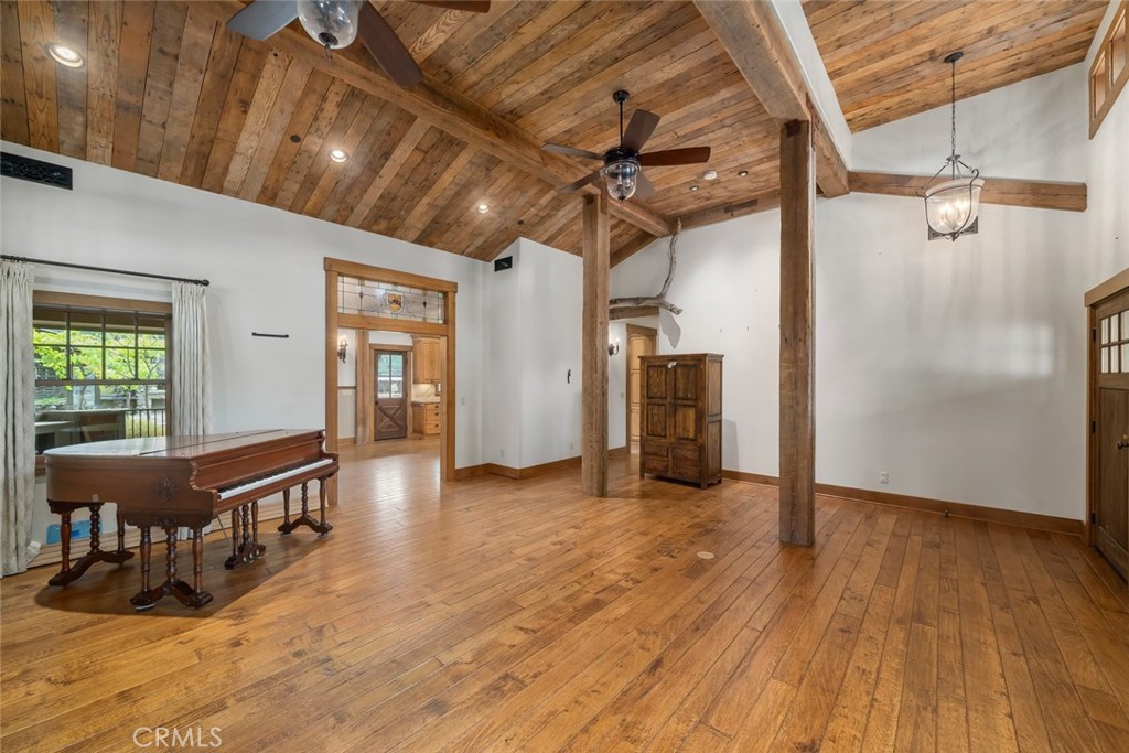 10330 Huasna Road Arroyo Grande, CA 93420 - Photo 7 of 74 a view of a livingroom with wooden floor and stairs