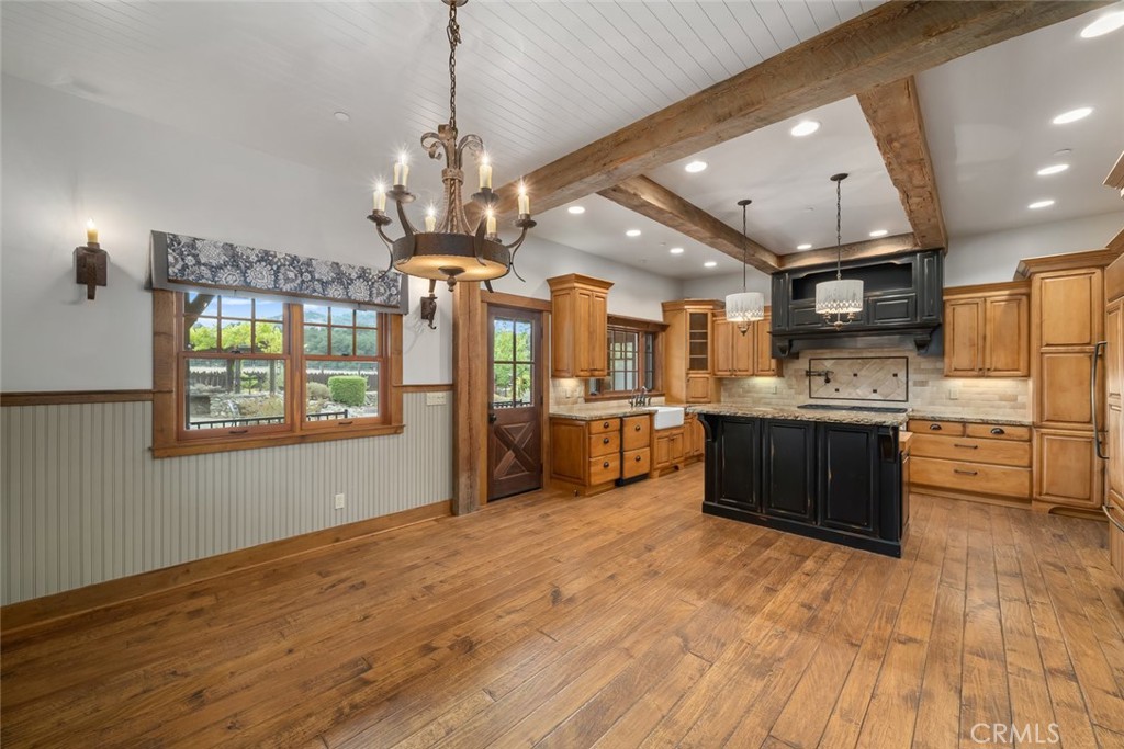 10330 Huasna Road Arroyo Grande, CA 93420 - Photo 8 of 74 a large kitchen with stainless steel appliances kitchen island granite countertop a large cabinets a sink and a dishwasher