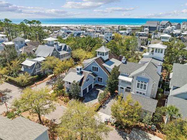 an aerial view of residential houses with outdoor space