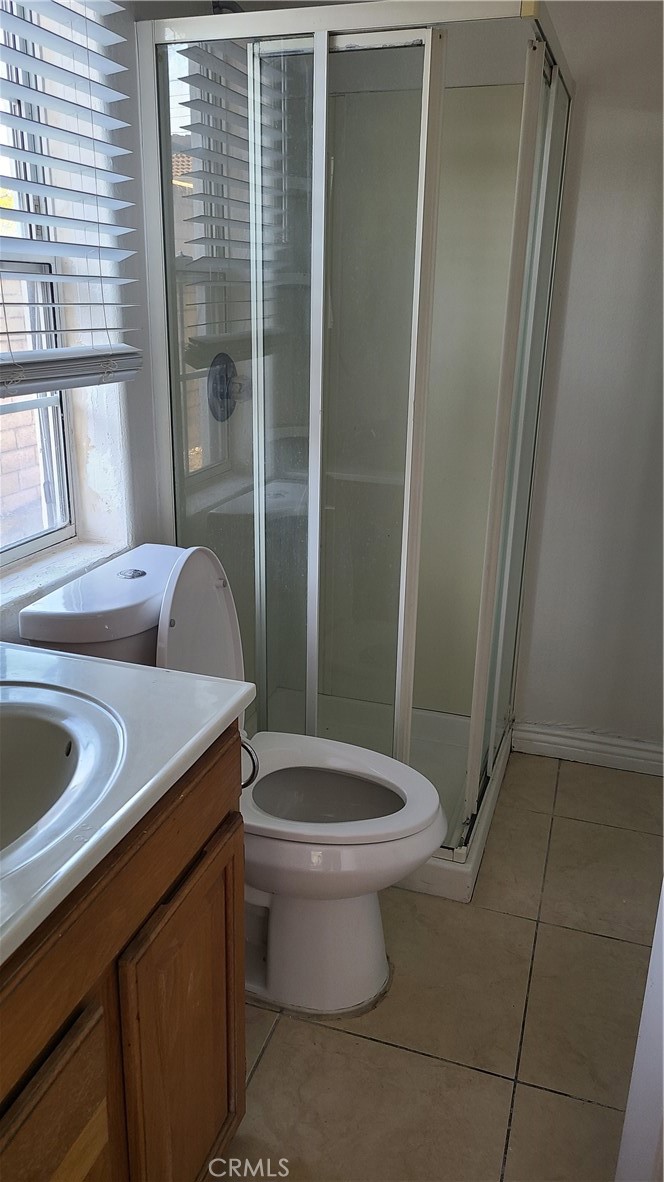 319 Lampman Way Placentia, CA 92870 - Photo 6 of 19 a bathroom with a sink a toilet and a shower