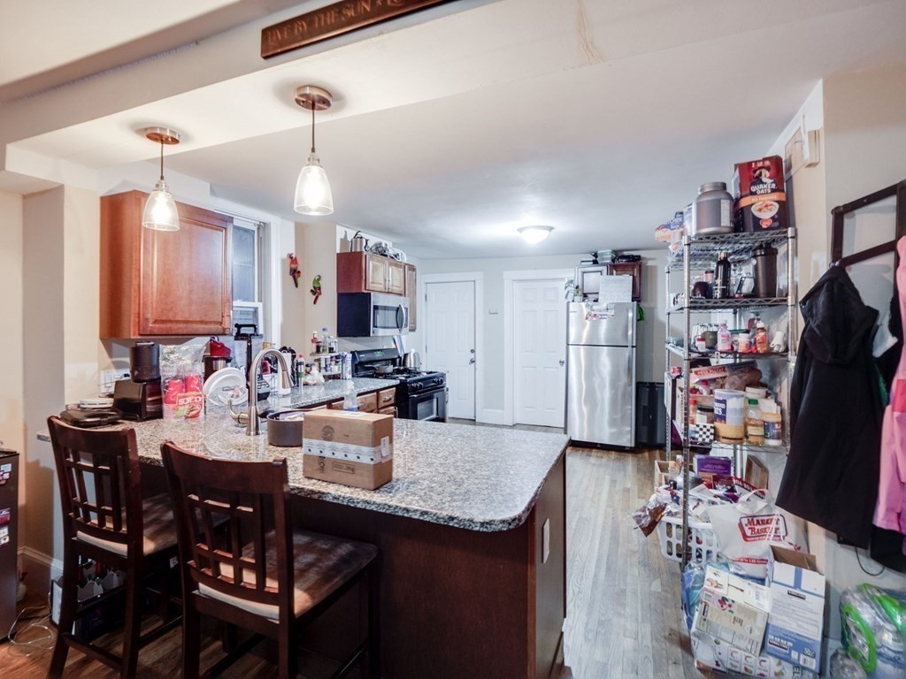 48 Chestnut Street Chelsea, MA 02150 - Photo 11 of 42 a view of a dining room with furniture and a kitchen