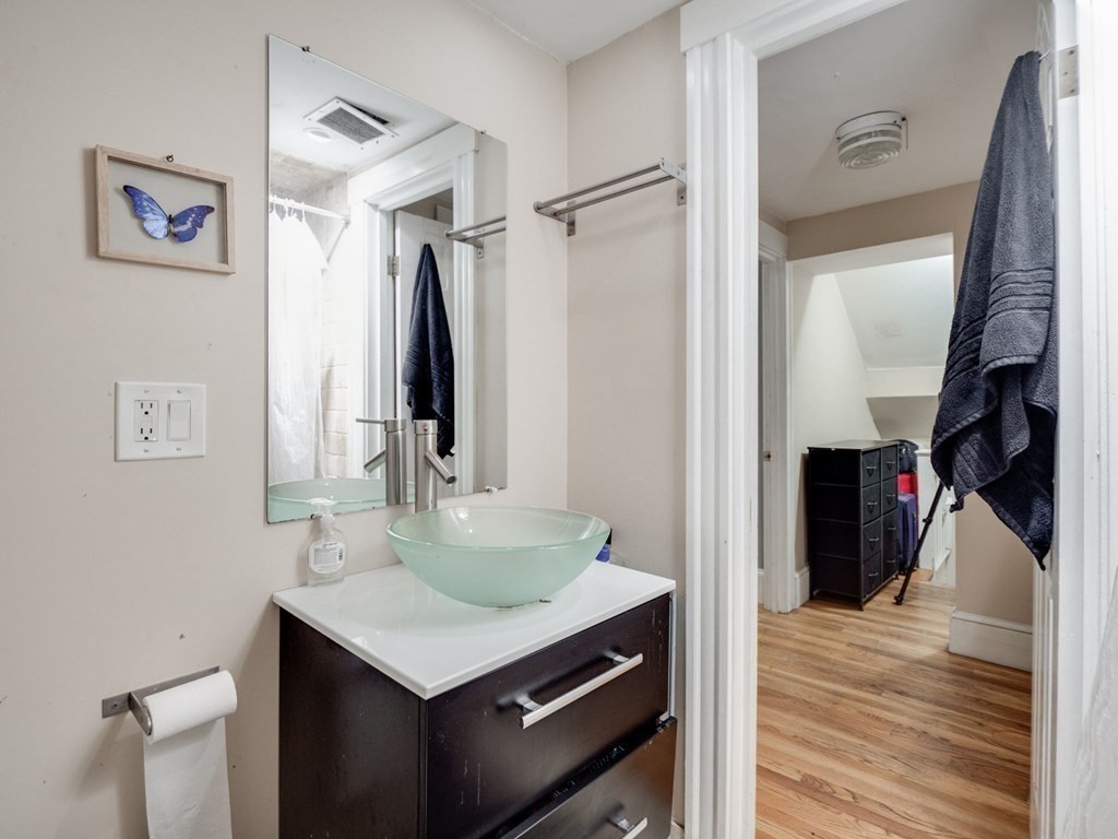 48 Chestnut Street Chelsea, MA 02150 - Photo 15 of 42 a bathroom with a sink vanity and a mirror