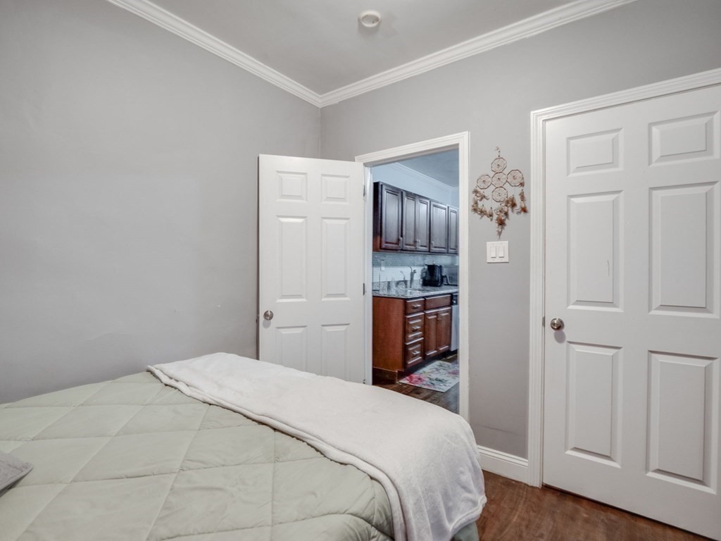 48 Chestnut Street Chelsea, MA 02150 - Photo 20 of 42 a bedroom with a bed and closet