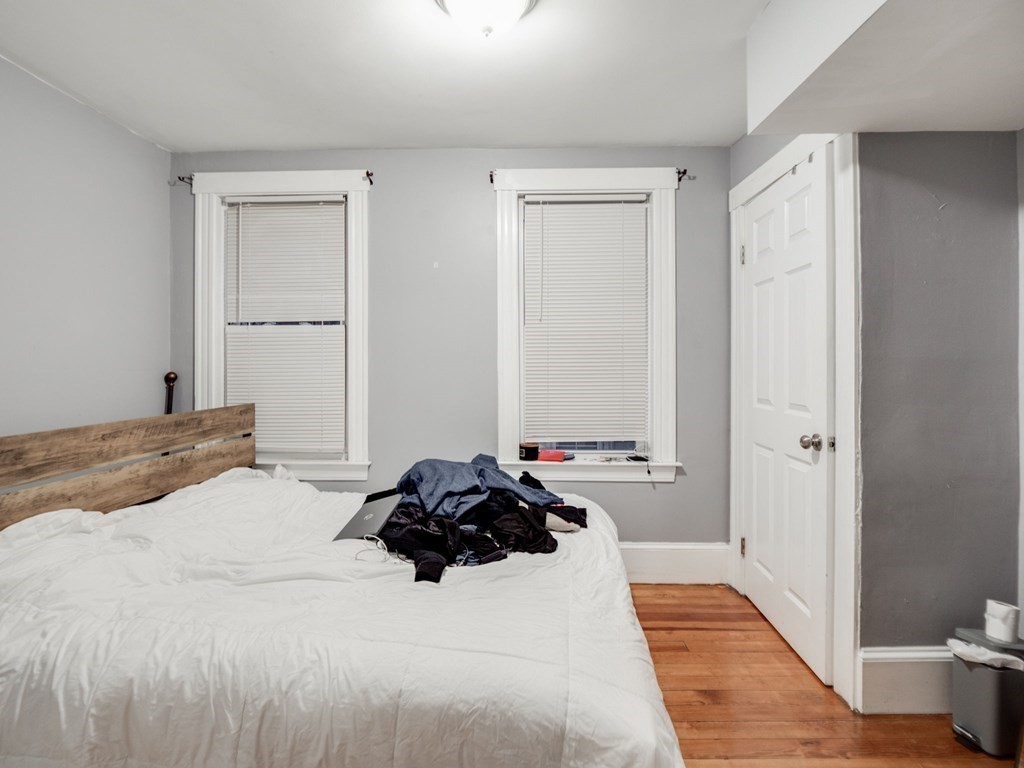 48 Chestnut Street Chelsea, MA 02150 - Photo 21 of 42 a bedroom with a bed and a window