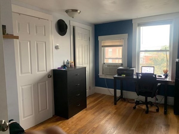 48 Chestnut Street Chelsea, MA 02150 - Photo 29 of 42 a living room with furniture and a large window