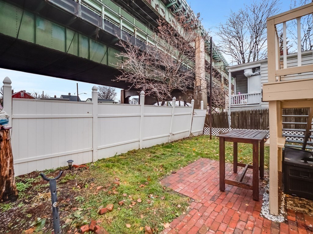 48 Chestnut Street Chelsea, MA 02150 - Photo 37 of 42 a view of a house with a yard