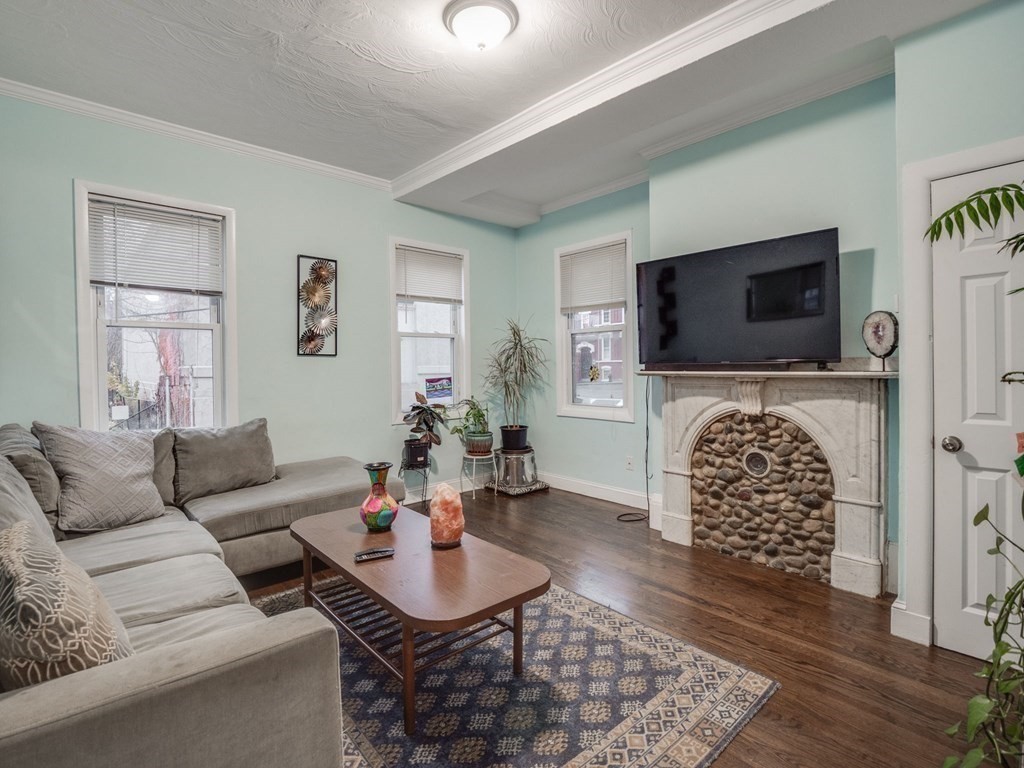 48 Chestnut Street Chelsea, MA 02150 - Photo 5 of 42 a living room with furniture and a flat screen tv