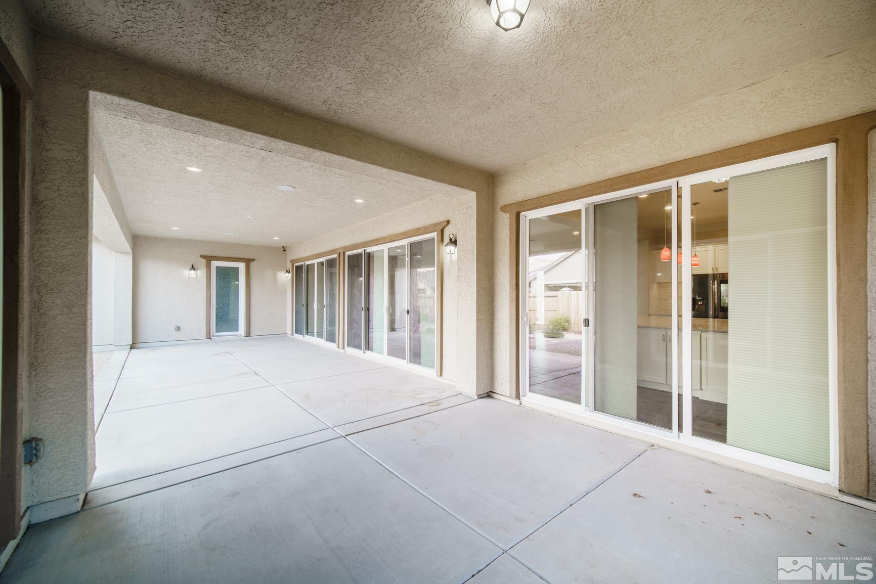 9576 Gazala Lane Reno, NV 89521 - Photo 33 of 40 a bedroom with a large bed and a large window