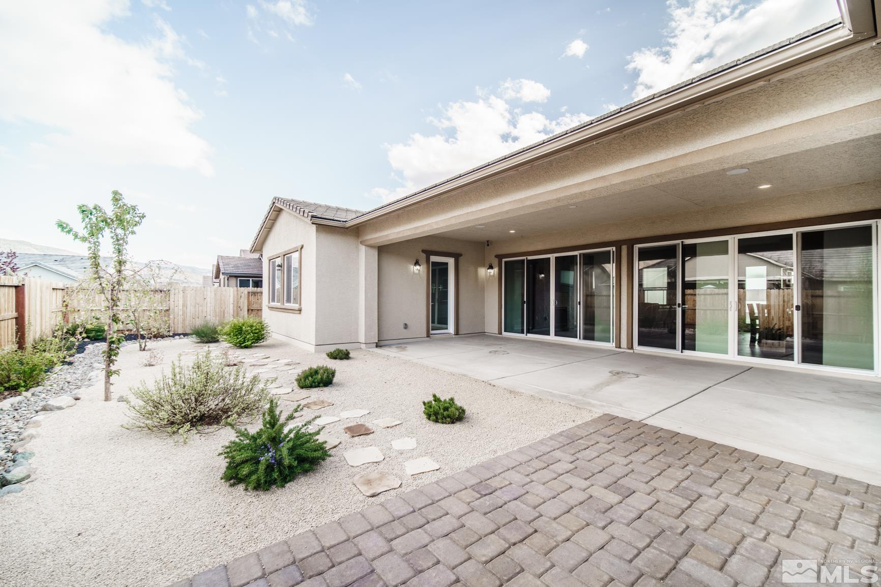 9576 Gazala Lane Reno, NV 89521 - Photo 39 of 40 a view of a house with backyard and sitting area