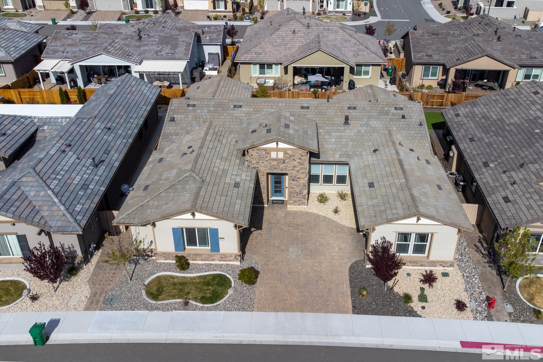 9576 Gazala Lane Reno, NV 89521 - Photo 4 of 40 an aerial view of multiple houses with a yard