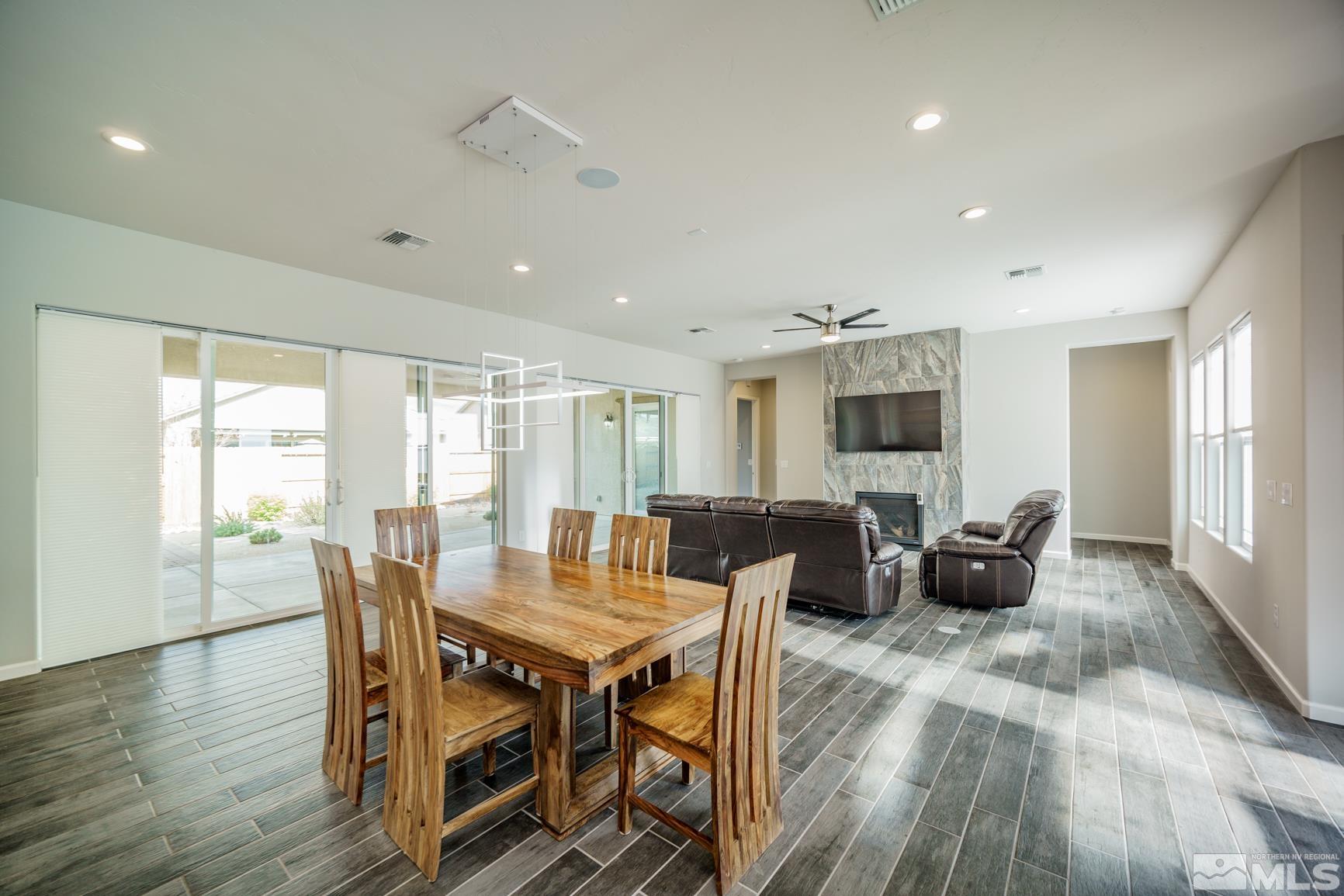 9576 Gazala Lane Reno, NV 89521 - Photo 8 of 40 a view of a dining room with furniture window and wooden floor