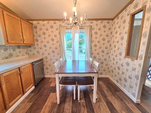 a view of kitchen with furniture and wooden floor