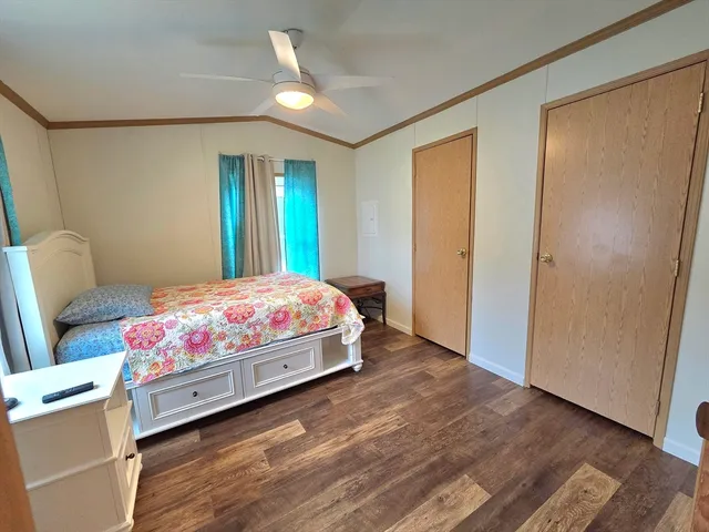 a room with a bed and a window