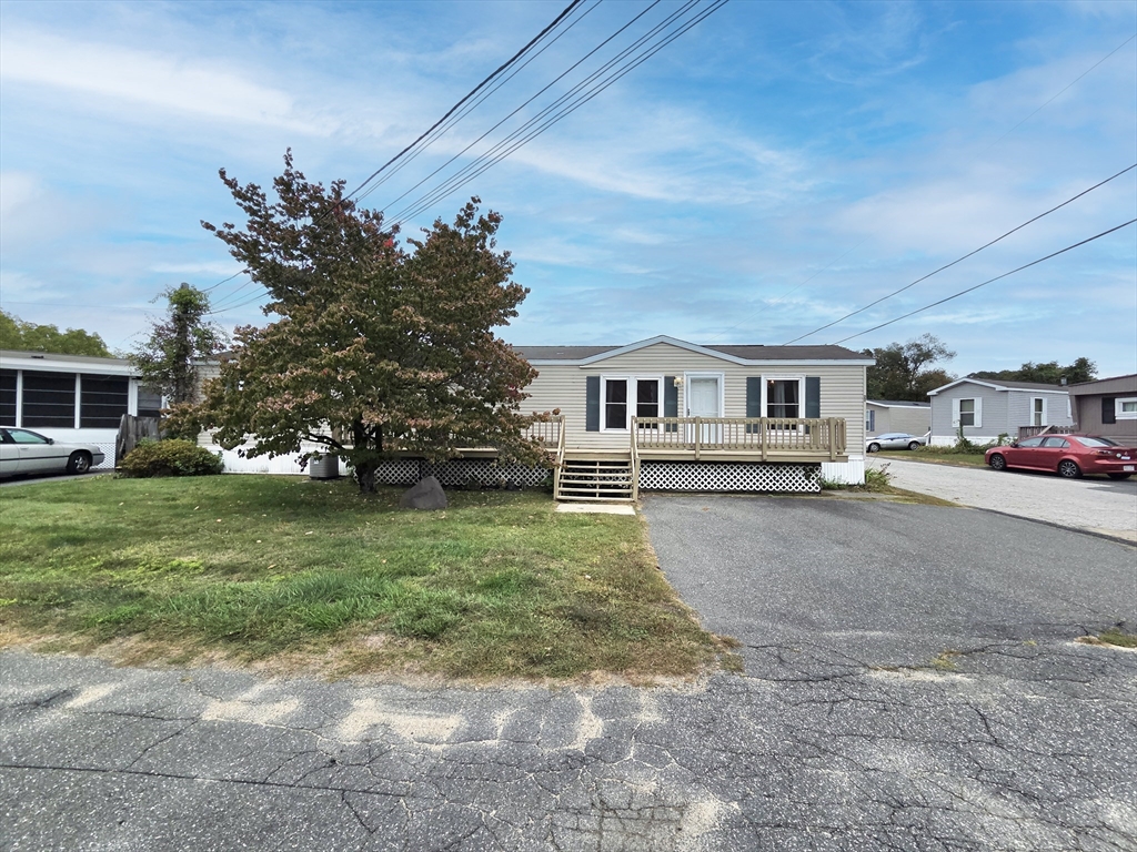 268 Palmer Road, Unit 27 Monson, MA 01057 - Photo 3 of 26 a house view with a garden space
