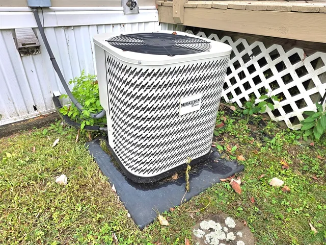 a kitchen with a sink and wooden floor