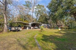 651 Old Haw Creek Road Bunnell, FL 32110 - Photo 26 of 28 a view of a lake with houses