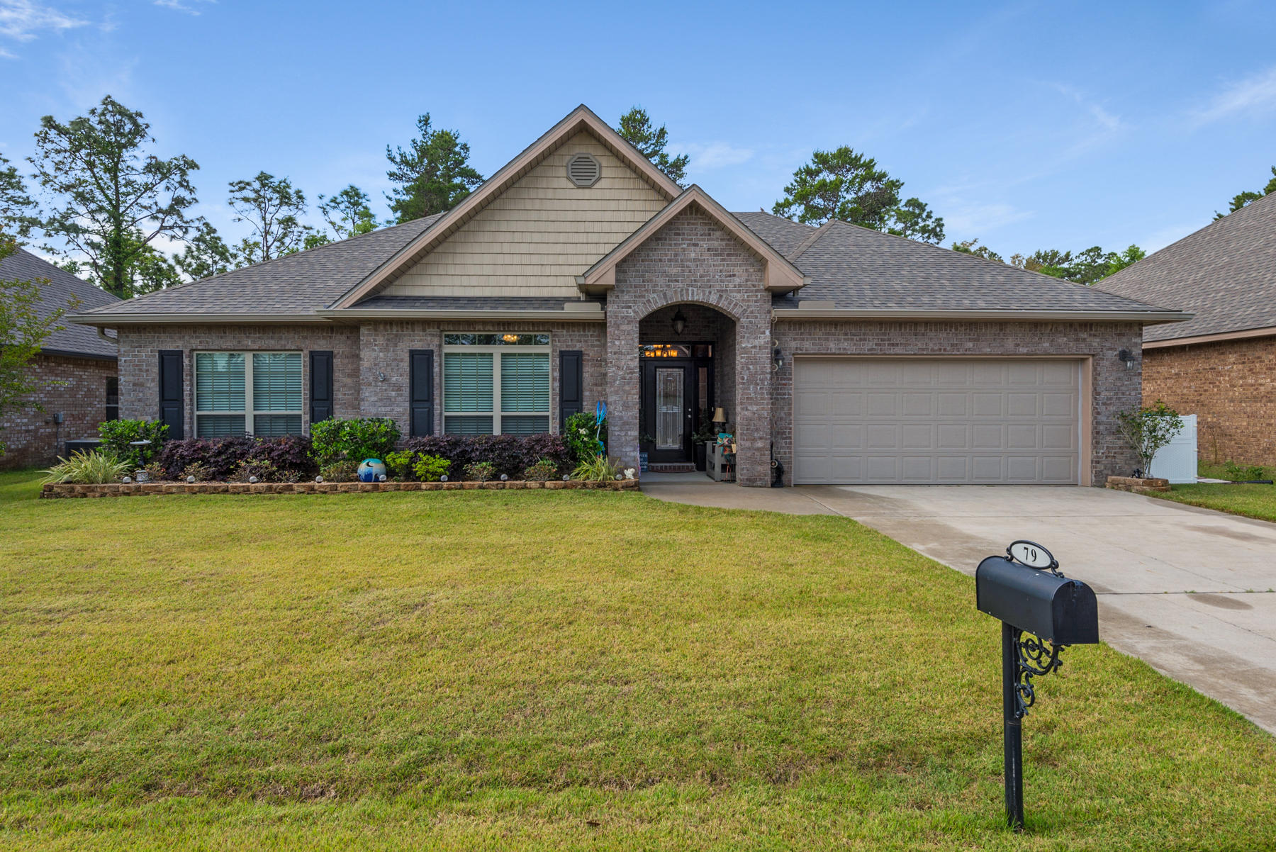 a front view of house with yard and outdoor seating