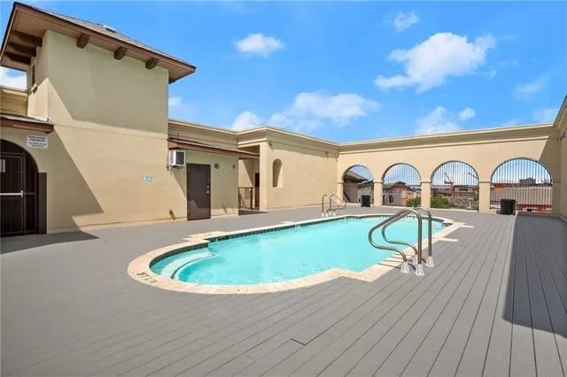 a view of swimming pool with a seating space
