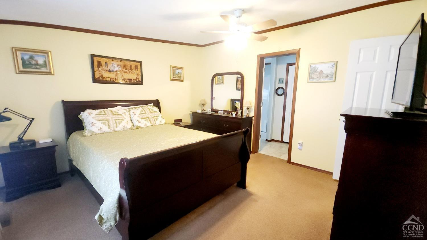 76 Gibson Road Durham, NY 12083 - Photo 11 of 22 a bed room with a bed and a black wall painting