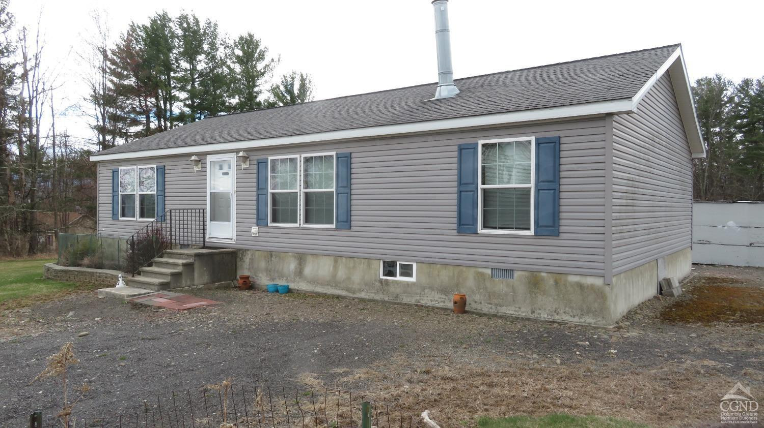76 Gibson Road Durham, NY 12083 - Photo 3 of 22 a front view of a house with a yard
