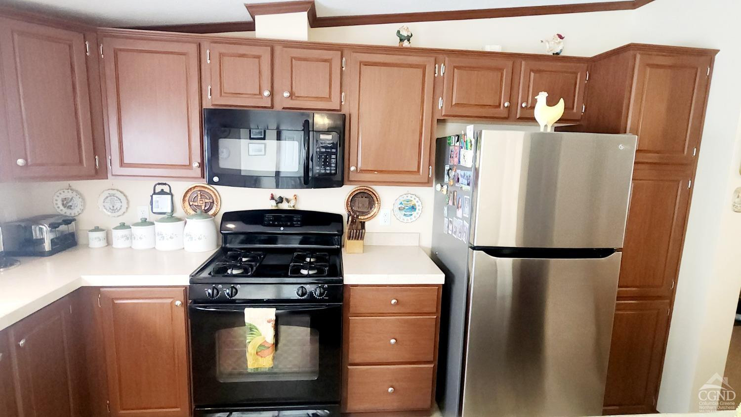 76 Gibson Road Durham, NY 12083 - Photo 5 of 22 a kitchen with stainless steel appliances granite countertop a refrigerator a stove and a sink