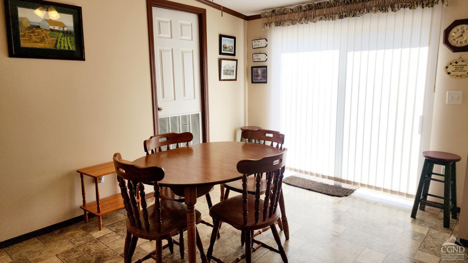 76 Gibson Road Durham, NY 12083 - Photo 8 of 22 a view of a dining room with furniture and a window