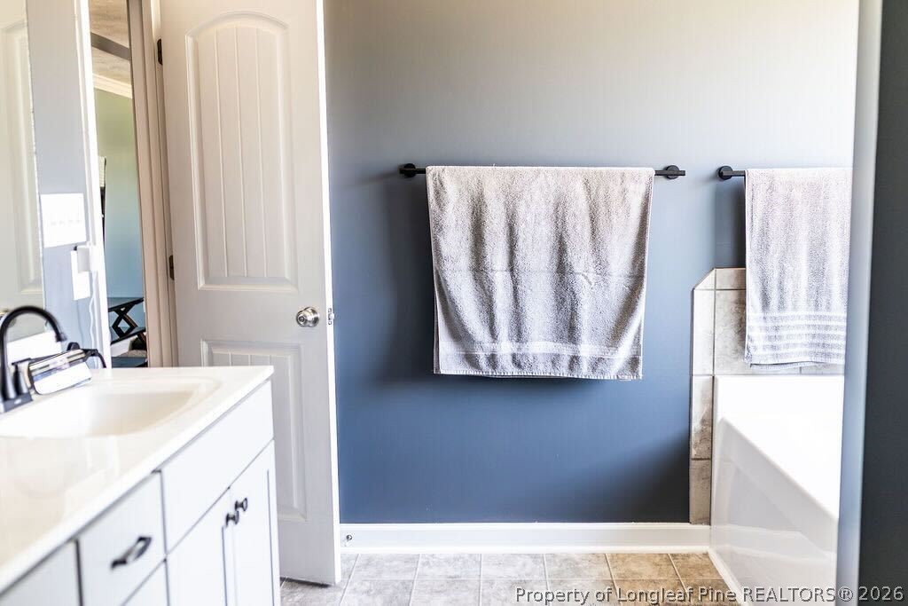 210 McGougan Road Lumber Bridge, NC 28357 - Photo 26 of 47 a bathroom with a sink and a mirror