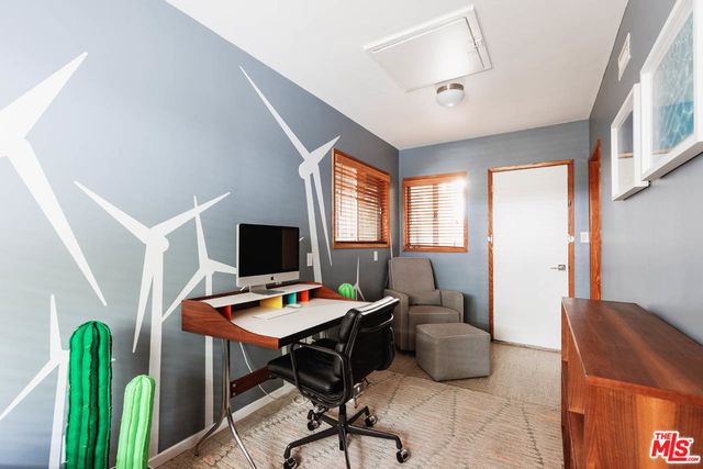 a workspace with furniture and a window