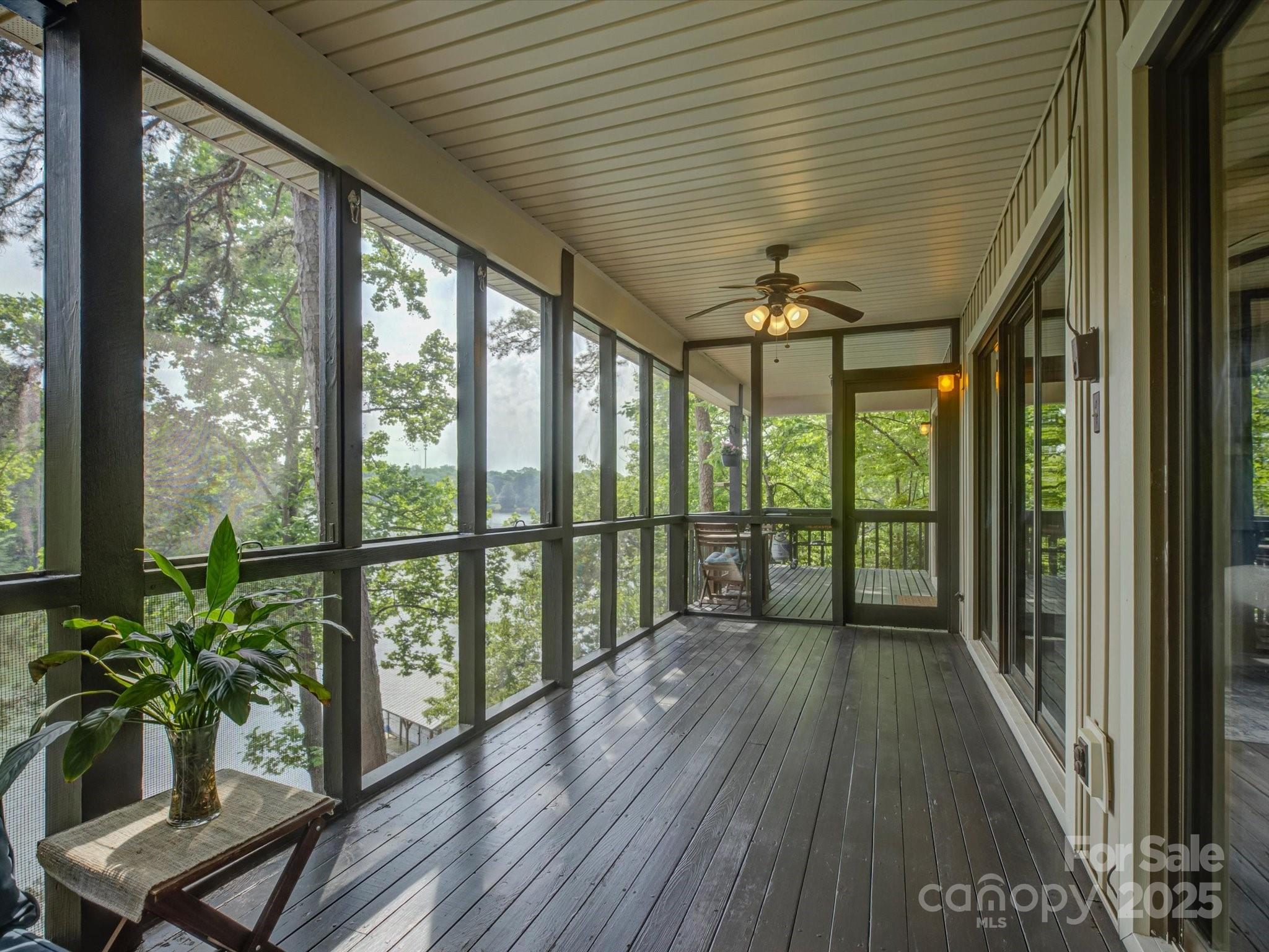 1114 Palmyra Drive Tega Cay, SC 29708 - Photo 11 of 48 a view of a porch with wooden floor