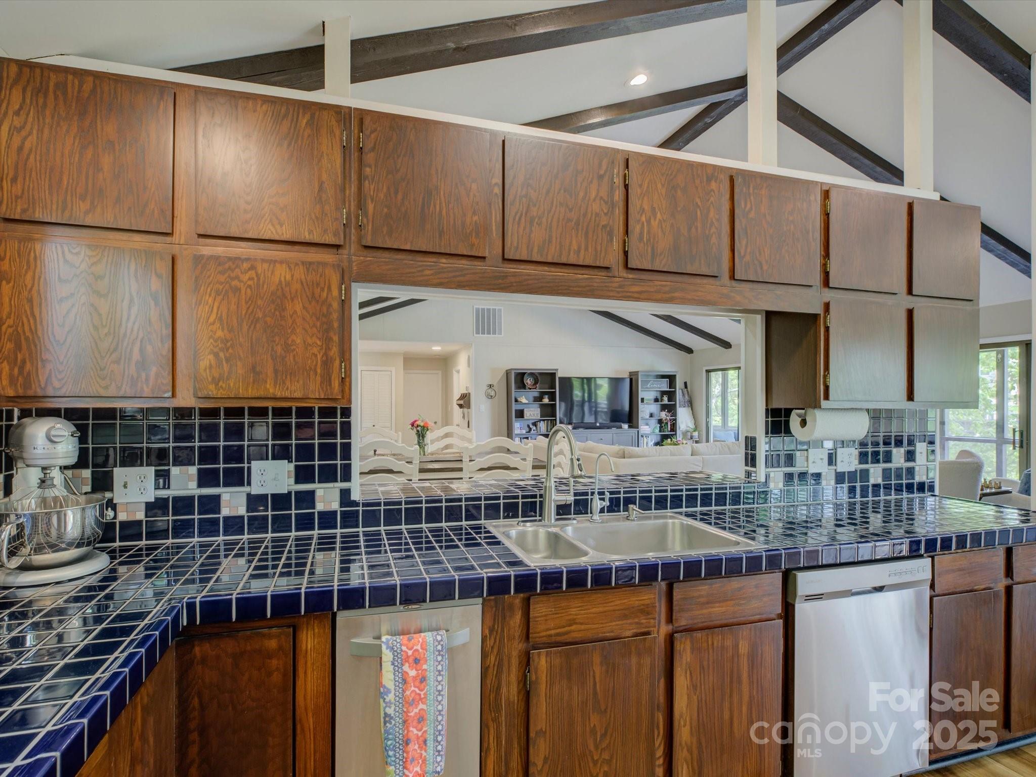 1114 Palmyra Drive Tega Cay, SC 29708 - Photo 14 of 48 a kitchen with stainless steel appliances granite countertop a sink and cabinets