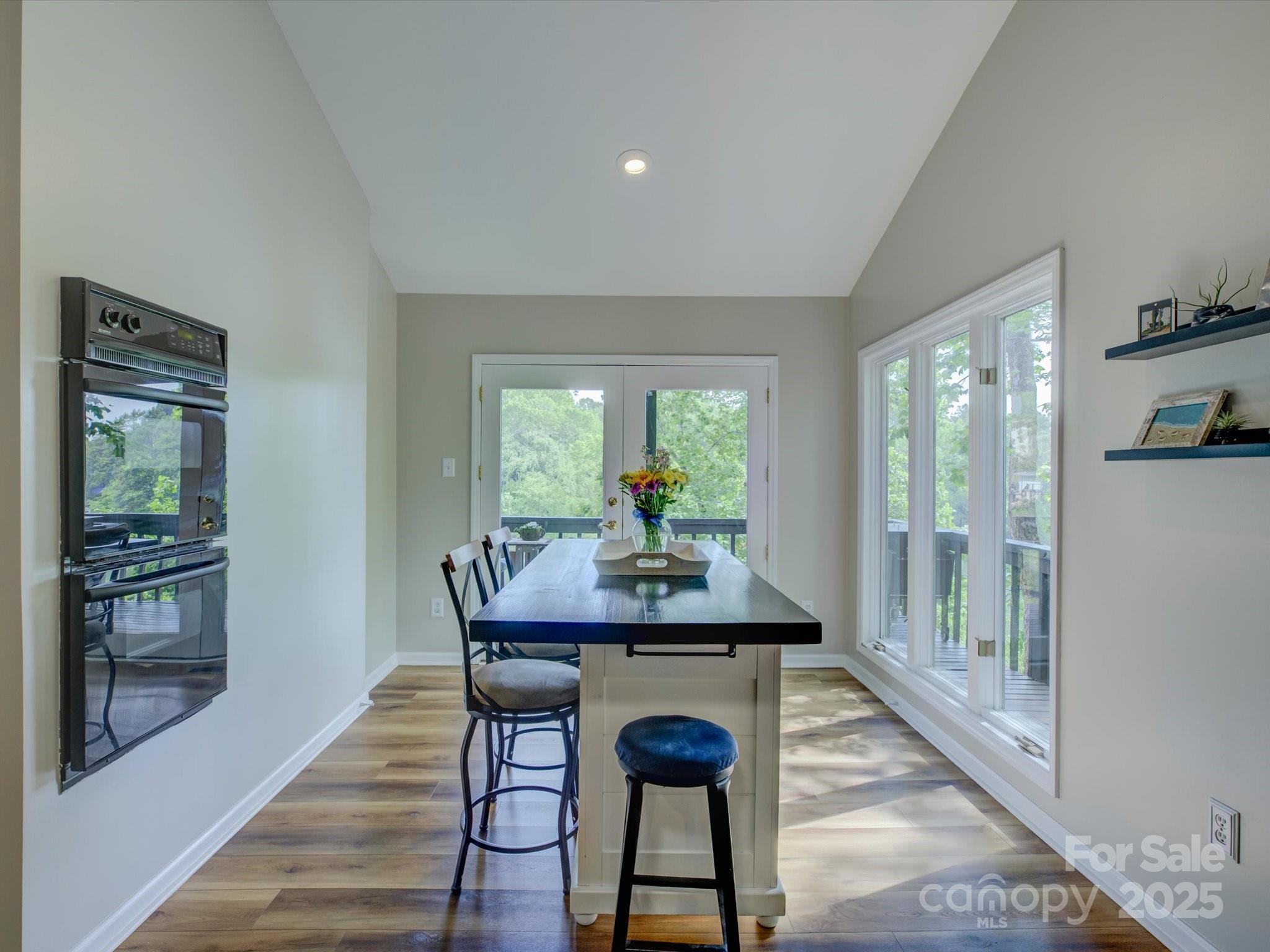 1114 Palmyra Drive Tega Cay, SC 29708 - Photo 15 of 48 a dining room with furniture and wooden floor