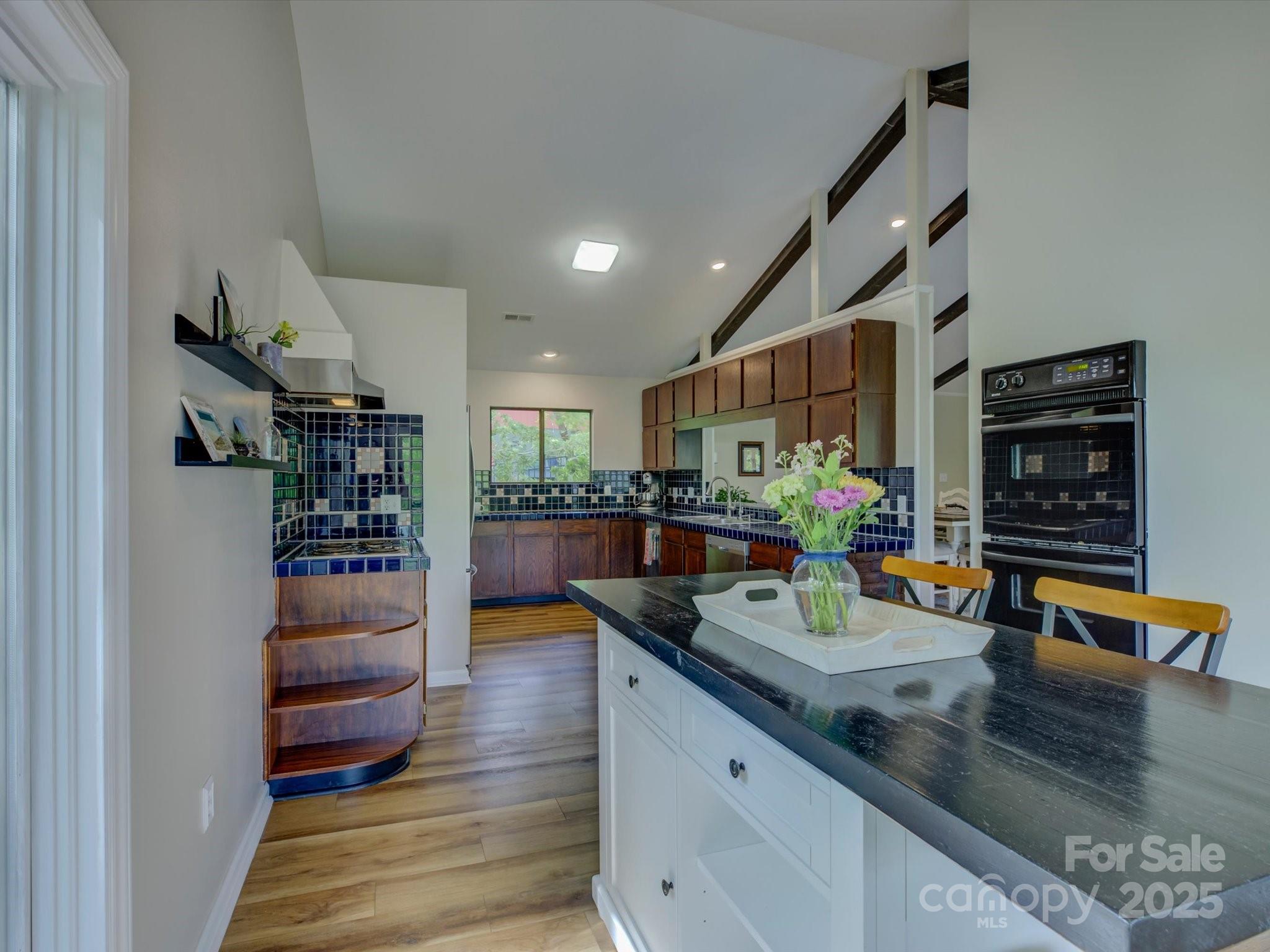 1114 Palmyra Drive Tega Cay, SC 29708 - Photo 16 of 48 a view of a living room and kitchen