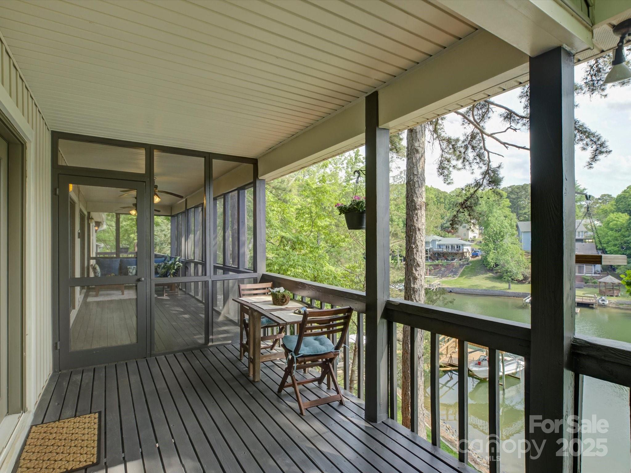 1114 Palmyra Drive Tega Cay, SC 29708 - Photo 17 of 48 a view of a patio with table and chairs