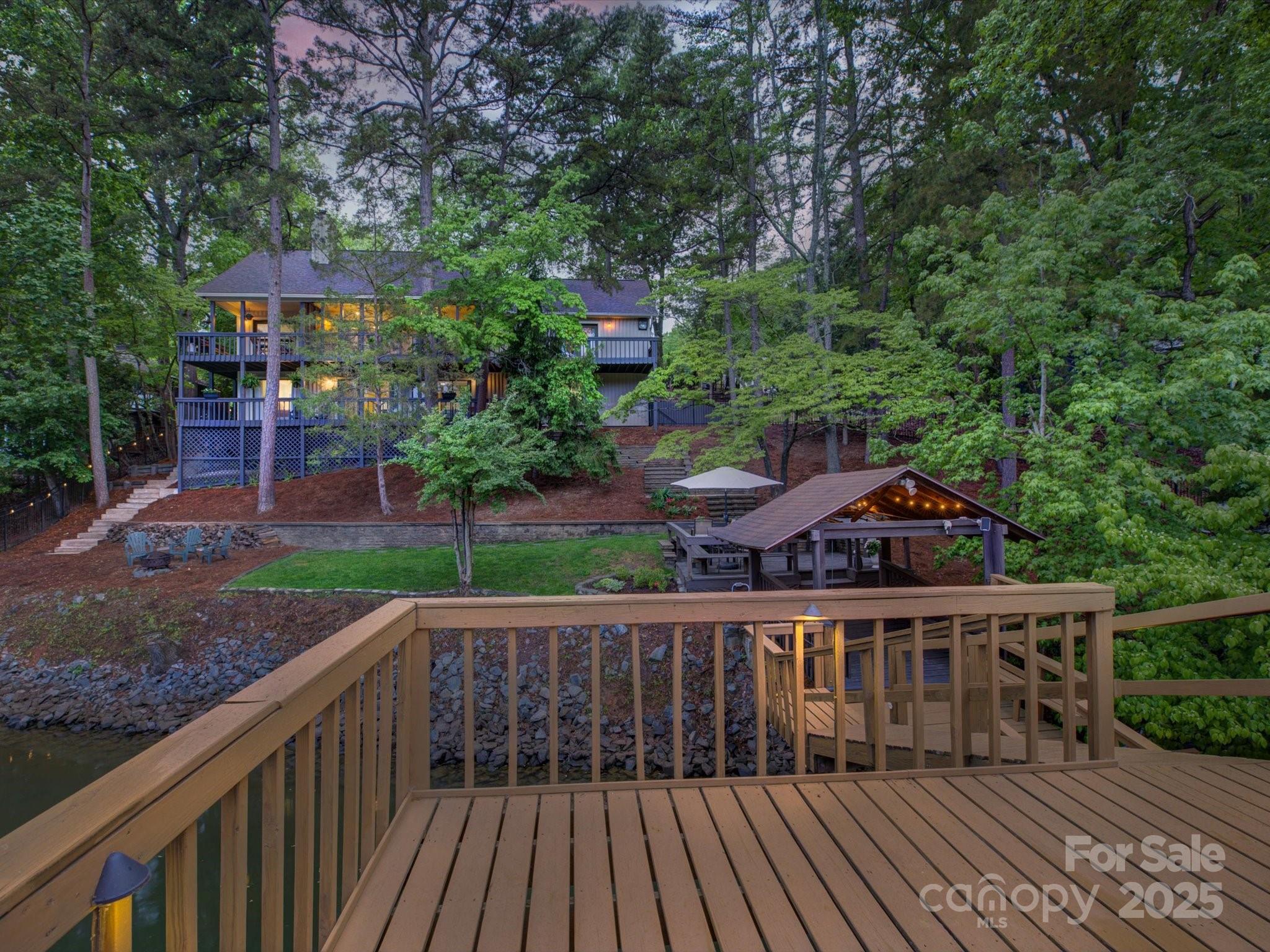 1114 Palmyra Drive Tega Cay, SC 29708 - Photo 2 of 48 a house view with a garden space