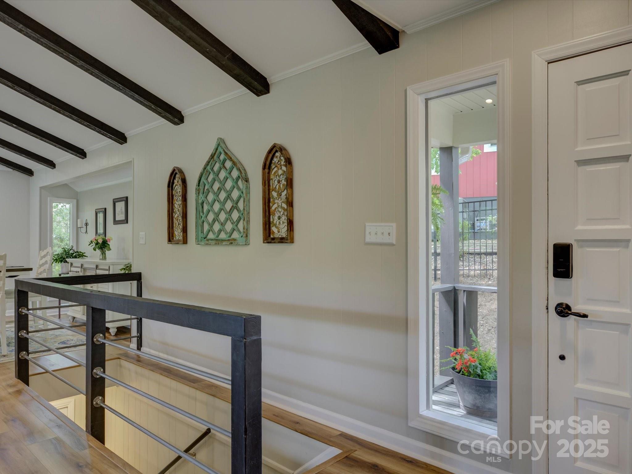 1114 Palmyra Drive Tega Cay, SC 29708 - Photo 24 of 48 a view of a hallway with wooden floor and furniture