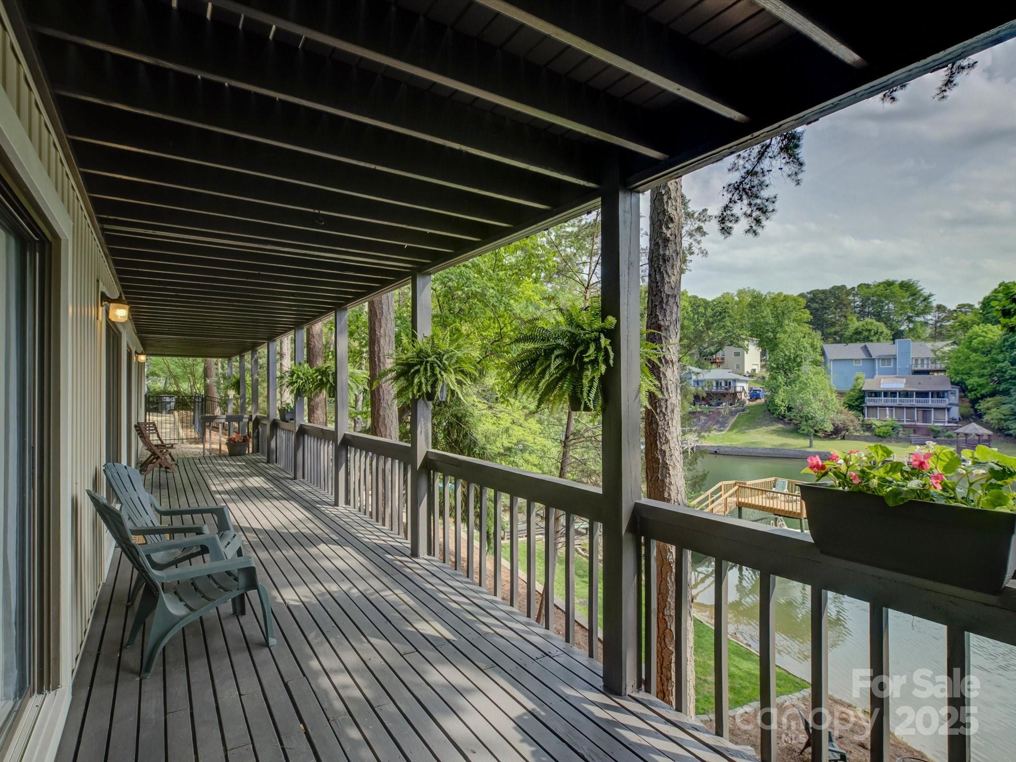 1114 Palmyra Drive Tega Cay, SC 29708 - Photo 33 of 48 a view of a chairs and table in the balcony