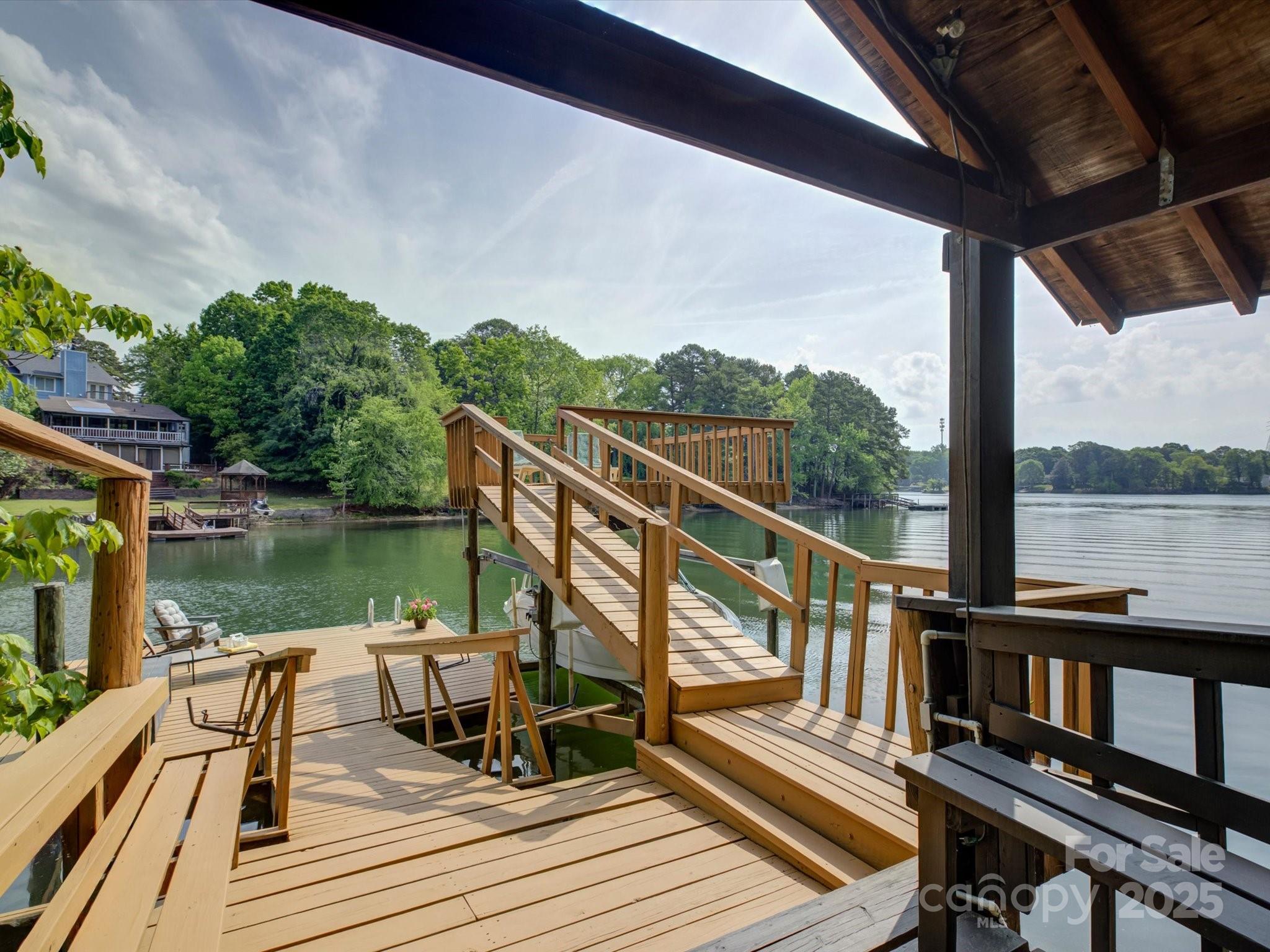 1114 Palmyra Drive Tega Cay, SC 29708 - Photo 38 of 48 a view of balcony with wooden floor and outdoor seating