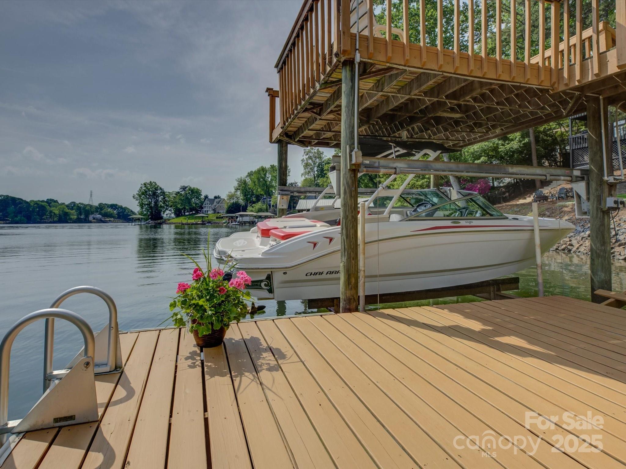 1114 Palmyra Drive Tega Cay, SC 29708 - Photo 44 of 48 a wooden bench sitting in front of a house