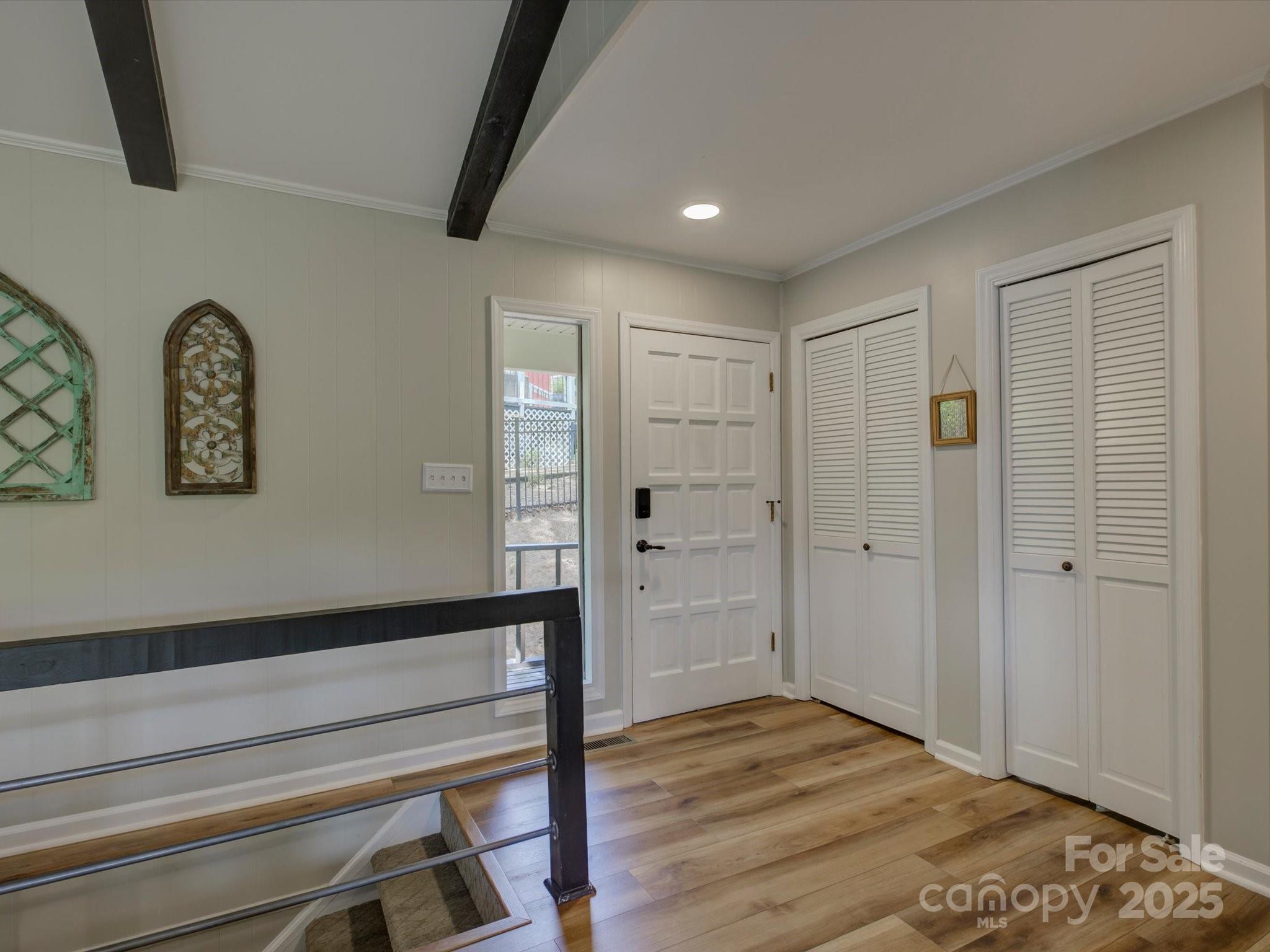1114 Palmyra Drive Tega Cay, SC 29708 - Photo 5 of 48 a view of empty room with wooden floor and fan