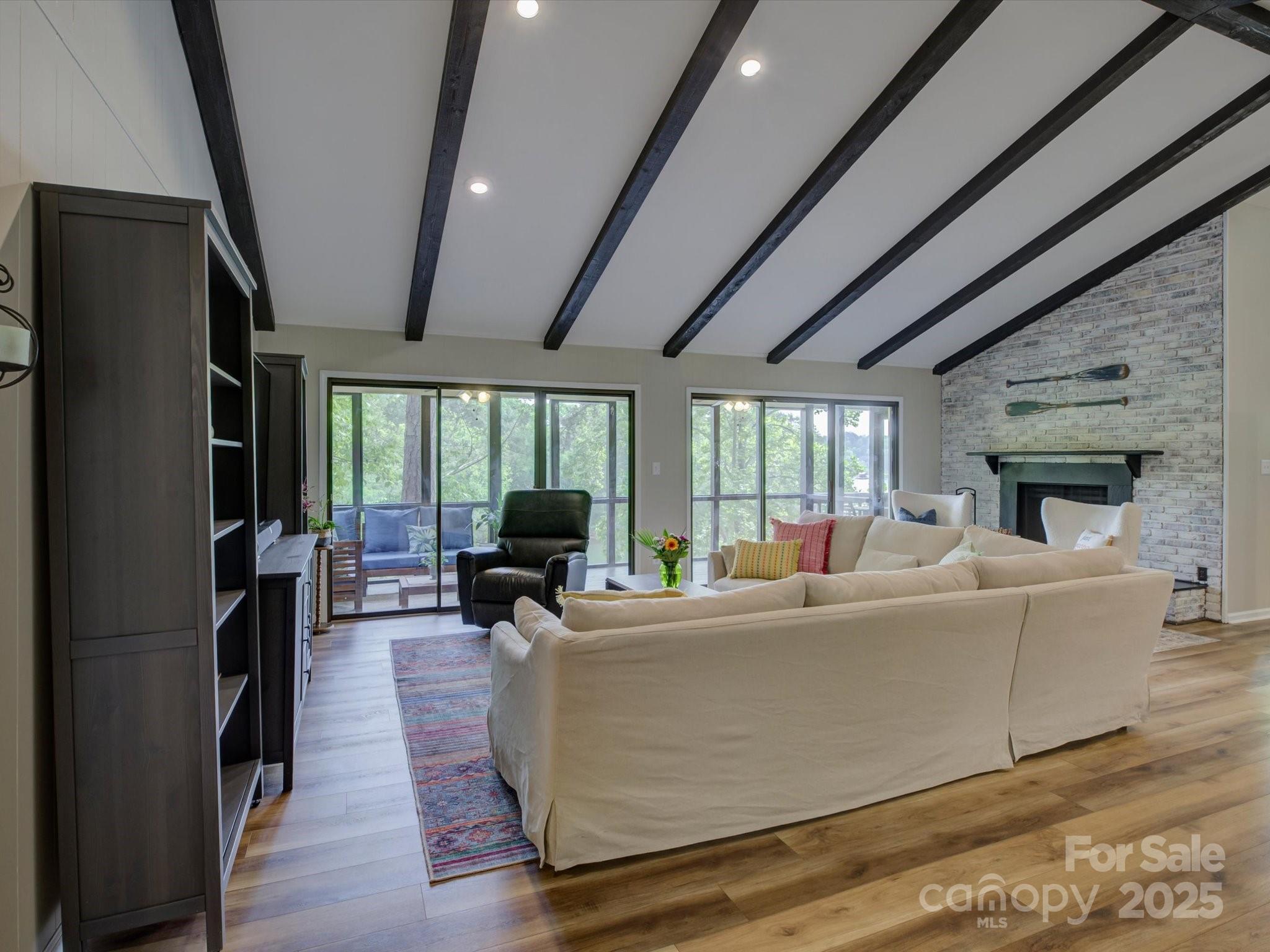 1114 Palmyra Drive Tega Cay, SC 29708 - Photo 6 of 48 a living room with furniture wooden floor and a fireplace