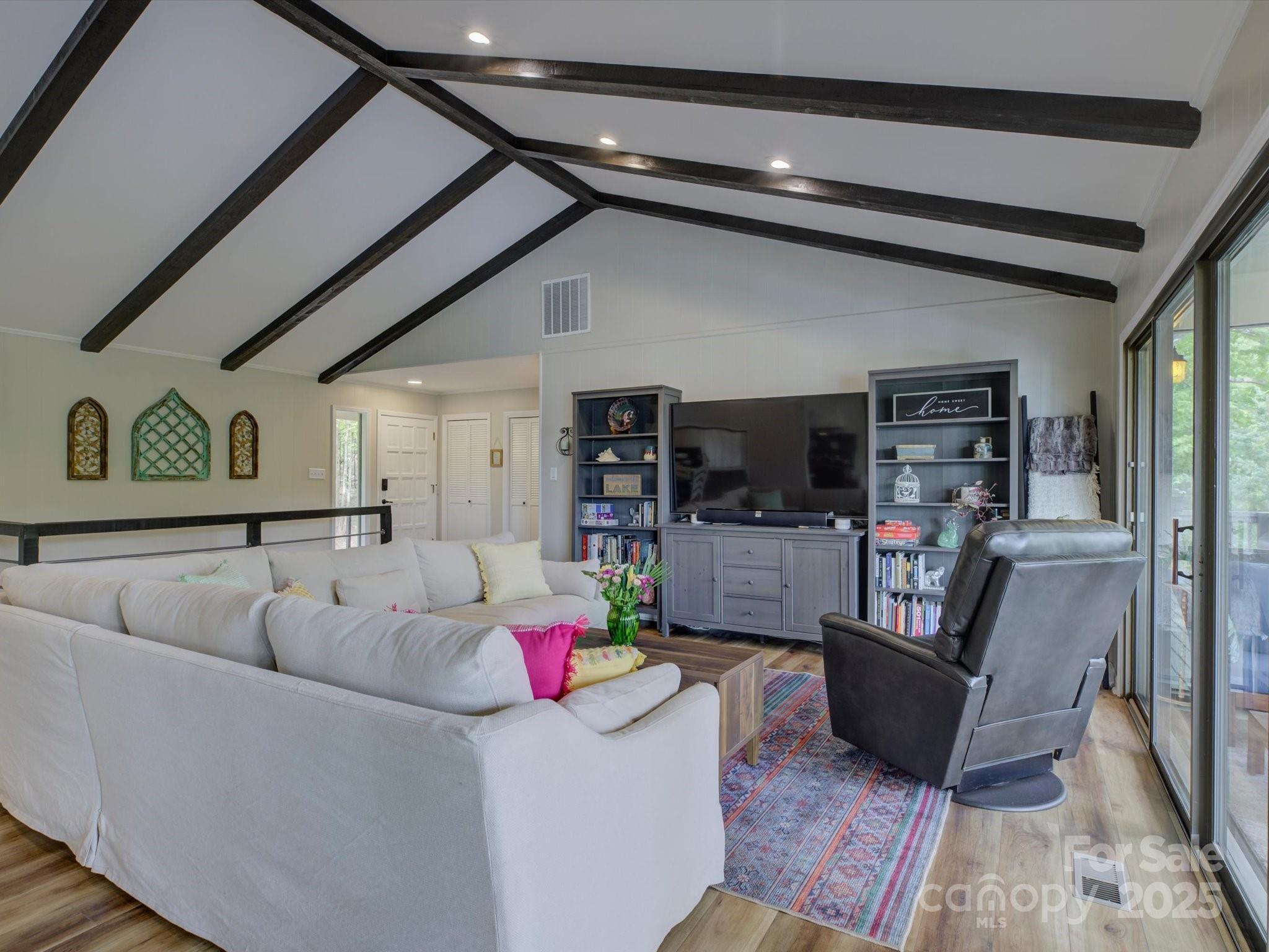 1114 Palmyra Drive Tega Cay, SC 29708 - Photo 9 of 48 a living room with furniture and a flat screen tv