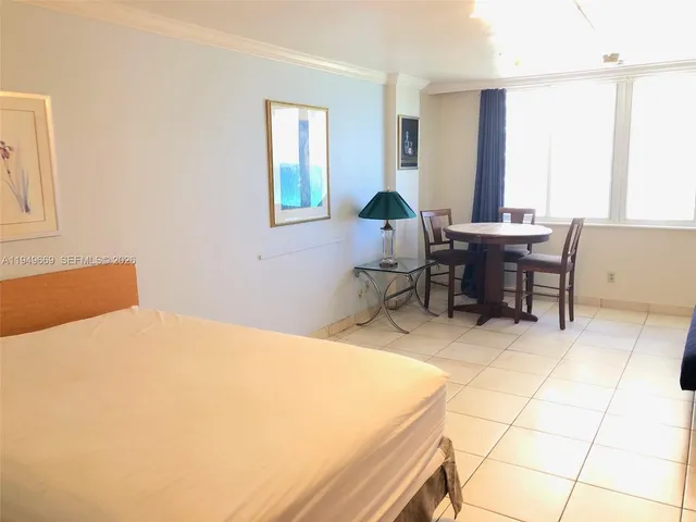 a bed room with a bed and a table