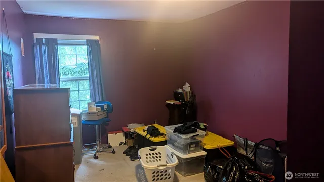 a dining room with furniture and a window