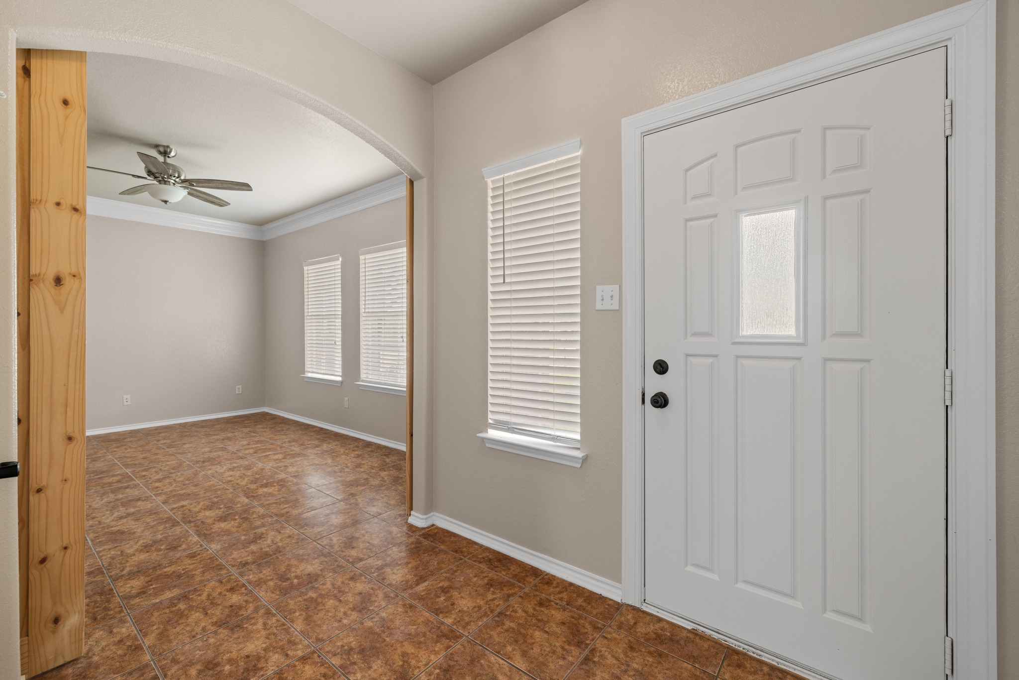 403 Red Hawk Drive Leander, TX 78641 - Photo 5 of 37 Entryway with a white paneled door featuring a frosted glass insert and black hardware